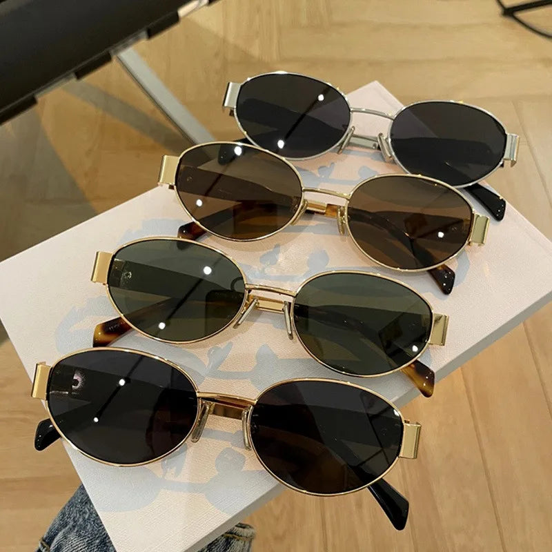 Vintage oval women's sunglasses with gold-tone metal frame and UV400 lenses